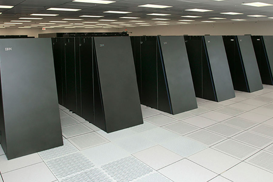 A series of large black cabinets with angled fronts that make up LLNL’s Blue Gene supercomputer. 