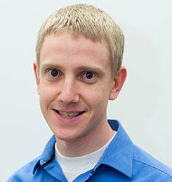 A headshot of Research Engineer Eric Elton.